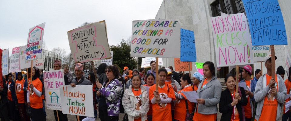 A Community Alliance of Tenants rally with protest signs