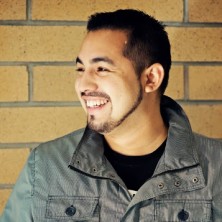 Diego Hernandez stands outside and looks off to the side